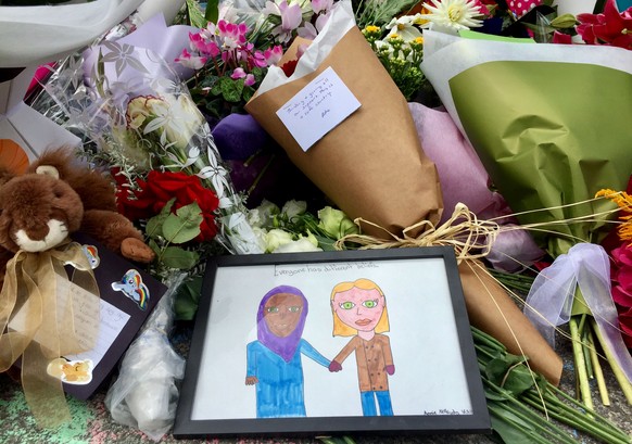 Flowers and tributes are placed outside the Islamic Centre in Kilbirnie, Wellington, New Zealand, Saturday, March 16, 2019. Mass shootings occurred at two mosques during midday prayers in Christchurch ...