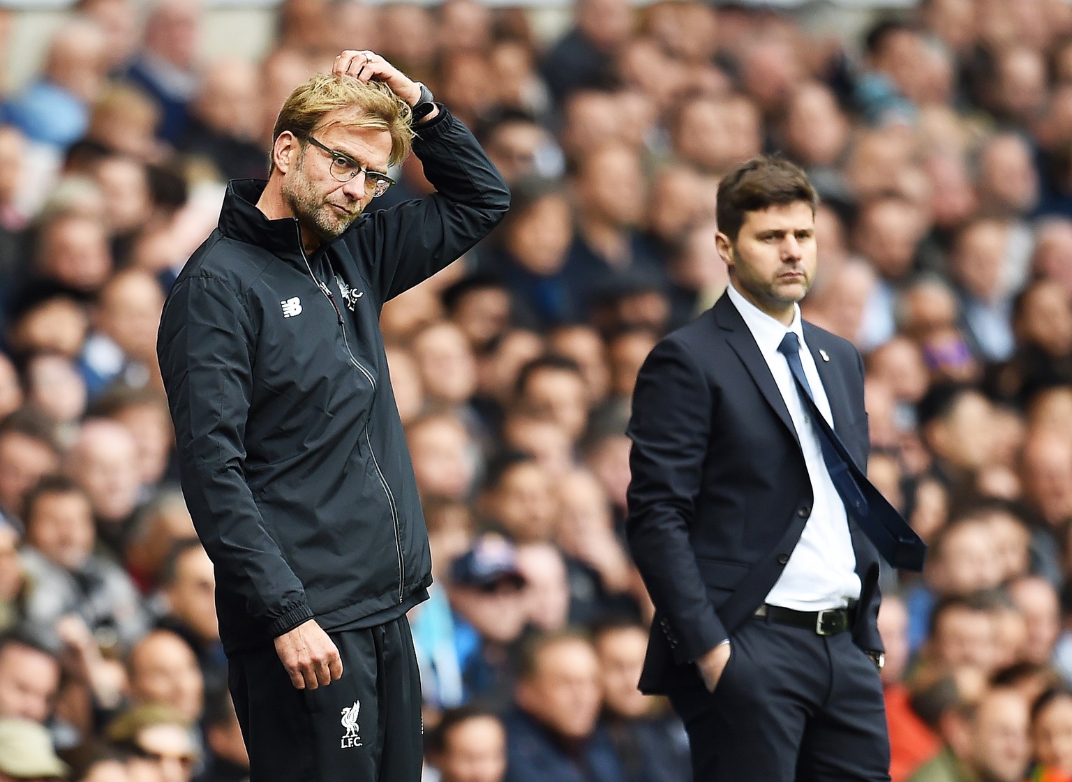 epa07557676 (FILE) - Liverpool manager Juergen Klopp (L) and Tottenham manager Mauricio Pochettino (R) during their team&#039;s 0-0 draw in the English Premier League soccer match between Tottenham Ho ...