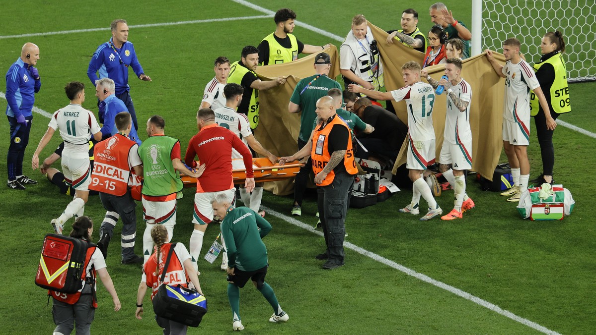epa11433158 Players of Hungary and medics take a stretcher to the pitch for Barnabas Varga of Hungary after he fell on the ground in an action during the UEFA EURO 2024 Group A soccer match between Sc ...
