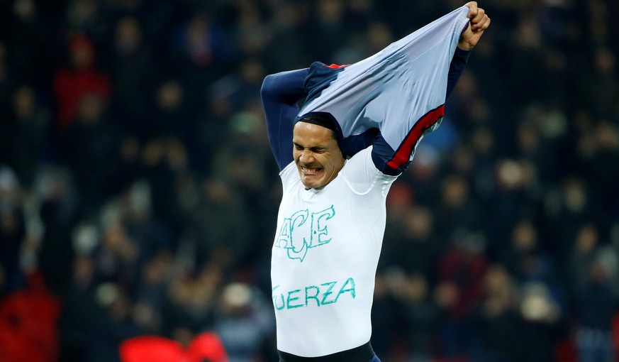 Football Soccer - Paris St Germain v Angers French Ligue 1 - Parc des Princes, Paris, France - 30/11/16. Paris Saint-Germain&#039;s Edinson Cavani reacts after scoring. The t-shirt reads &quot;strengt ...