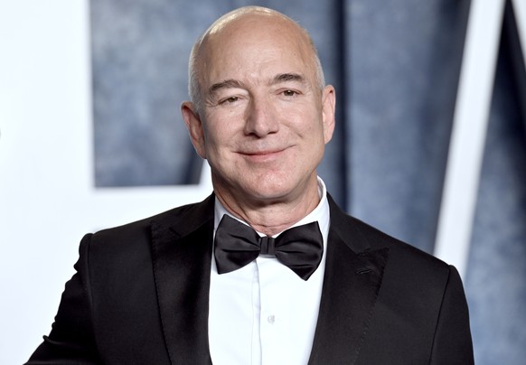 File - Amazon founder Jeff Bezos arrives at the Vanity Fair Oscar Party on March 12, 2023, in Beverly Hills, Calif. Amazon releases results on Thursday, Feb. 1, 2024. (Photo by Evan Agostini/Invision/ ...