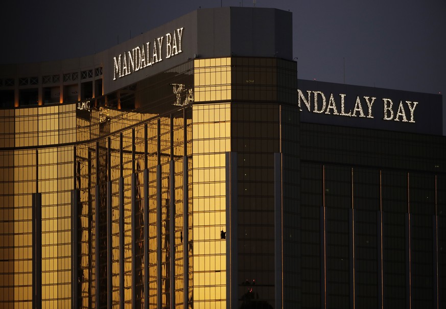 Windows are broken at the Mandalay Bay resort and casino, Tuesday, Oct. 3, 2017, in Las Vegas. Authorities said Stephen Craig Paddock broke the windows and began firing with a cache of weapons, killin ...