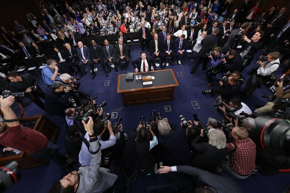 Former FBI director James Comey takes his seat at the beginning of the Senate Intelligence Committee hearing on Capitol Hill, Thursday, June 8, 2017, in Washington. (AP Photo/Andrew Harnik)