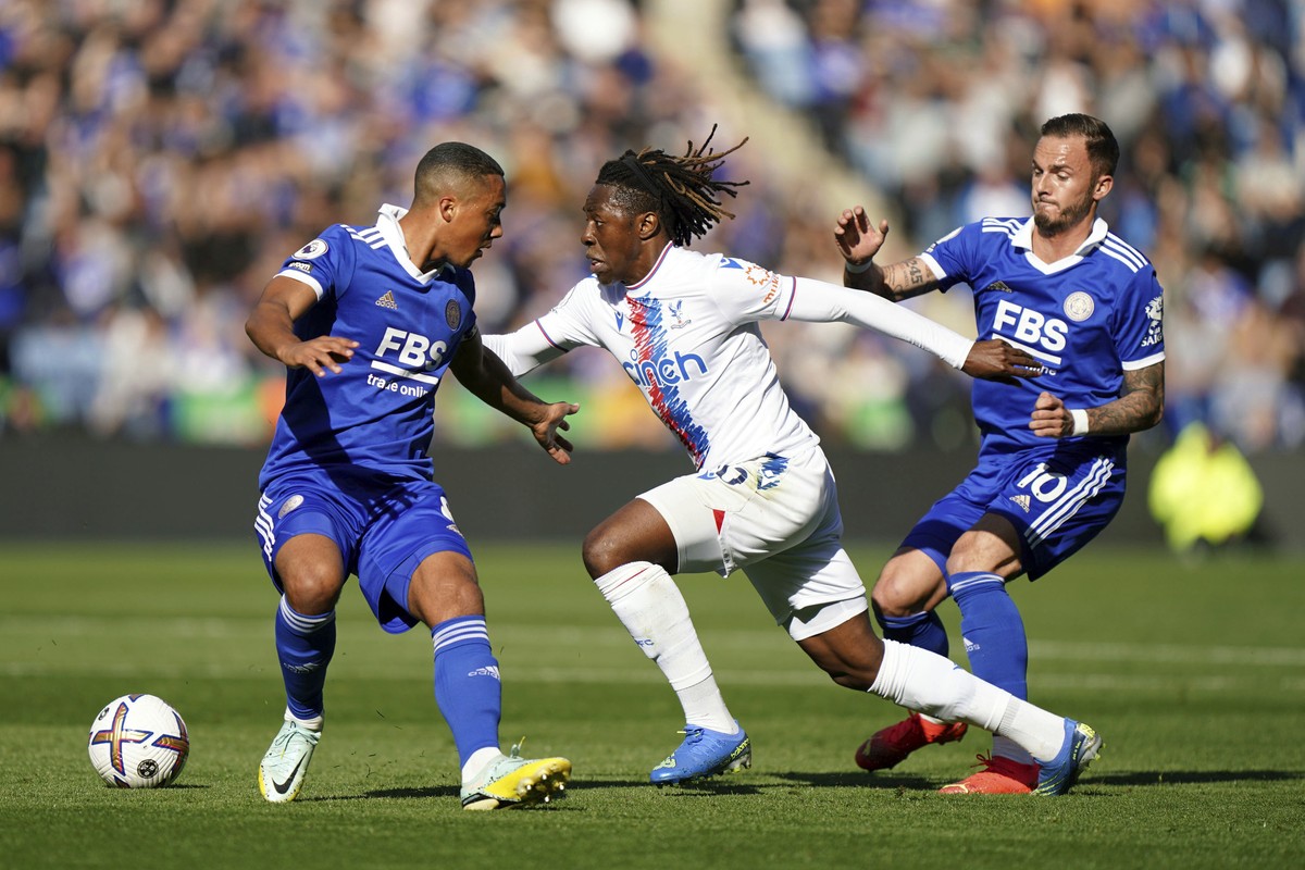 Leicester City's Youri Tielemans, Crystal Palace's Eberechi Eze and Leicester City's James Maddison, right, battle for the ball during the Premier League match between Leicester City an ...