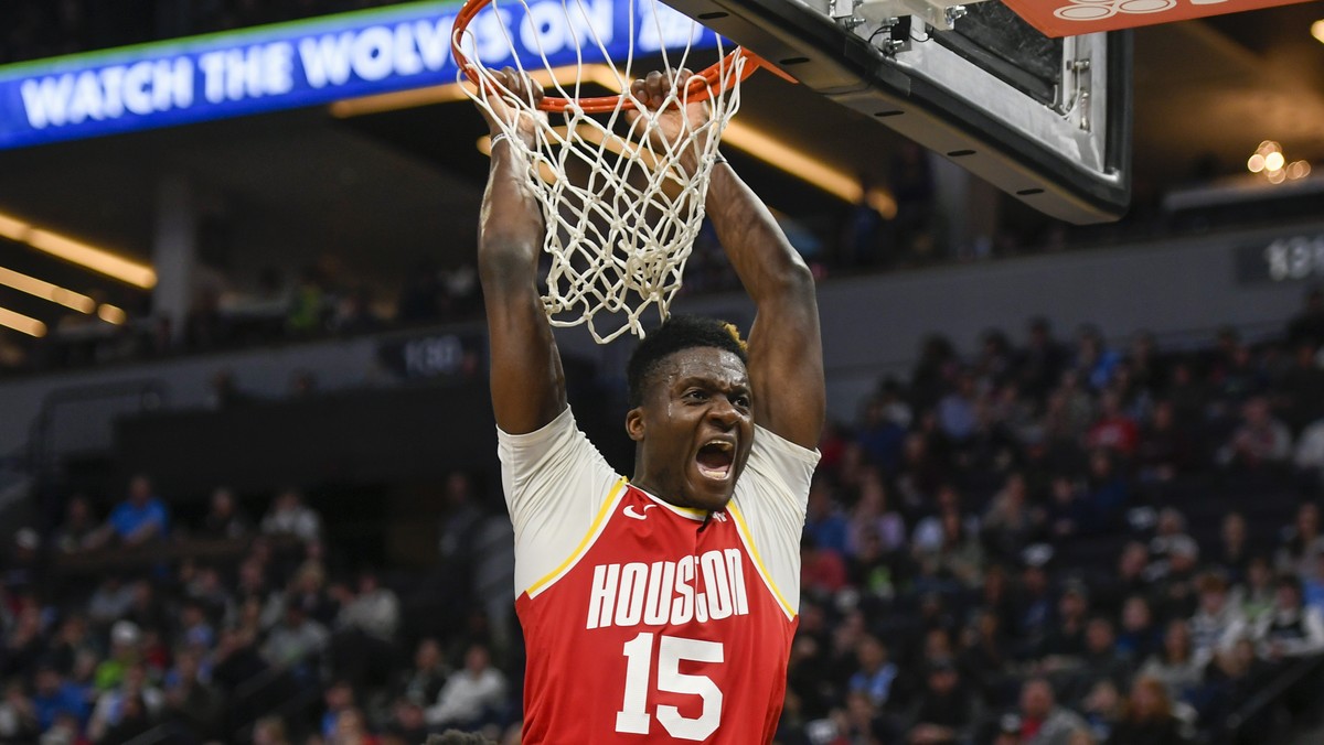 Houston Rockets center Clint Capela yells after dunking the ball against the Minnesota Timberwolves during the second half of an NBA basketball game Friday, Jan. 24, 2020, in Minneapolis. (AP Photo/Cr ...