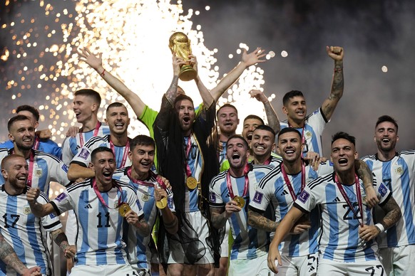 Argentina&#039;s Lionel Messi lifts the trophy after winning the World Cup final soccer match between Argentina and France at the Lusail Stadium in Lusail, Qatar, Sunday, Dec. 18, 2022. Argentina won  ...