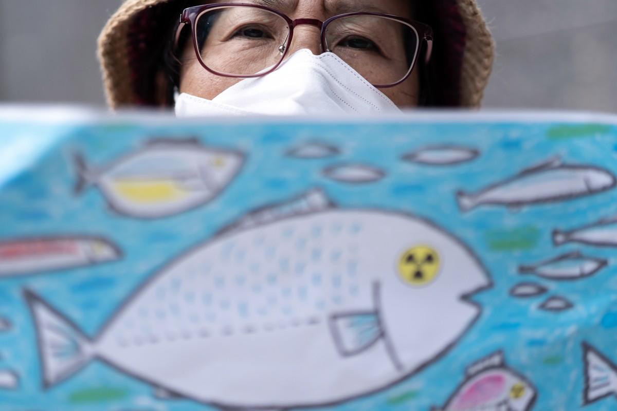 epa10816908 A protester takes part in a rally against the release of treated radioactive water from the Tokyo Electric Power Co. (Tepco) Fukushima Dai-ichi Nuclear Power Station outside the Tepco head ...