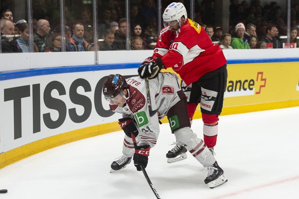 Rudolfs Balcer, left, in action against Switzerland&#039;s Roman Josi, during the friendly Ice Hockey match between Switzerland and Latvia in Weinfelden, Switzerland, Saturday, 04, May 2019. (KEYSTONE ...