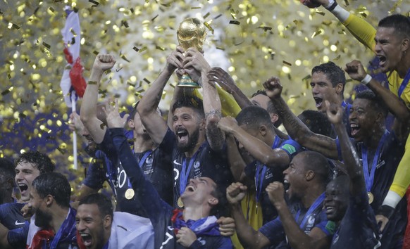 French players celebrates with the trophy after the final match against Croatia at the 2018 soccer World Cup in the Luzhniki Stadium in Moscow, Russia, Sunday, July 15, 2018. (AP Photo/Natacha Pisaren ...