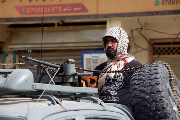 epa13065847 Taliban security stand guard to secure the route of mourning processions on Ashura Day in Kandahar, Afghanistan, 26 June 2026. Shiite Muslims worldwide are observing the holy month of Muha ...