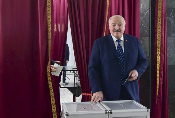 epa11180594 A handout picture made available by Belarusian Presidential Press Service shows Belarus&#039; President Alexander Lukashenko casting his ballot during the Belarusian parliamentary election ...