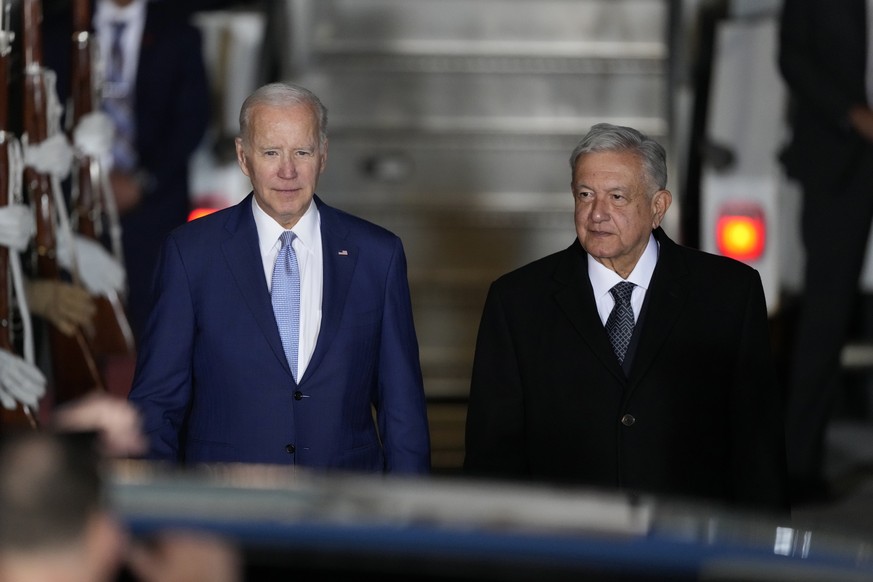 U.S. President Joe Biden walks with Mexican President Andres Manuel Lopez Obrador, at his arrival to the Felipe Angeles international airport in Zumpango, Mexico, Sunday, Jan. 8, 2023. (AP Photo/Ferna ...