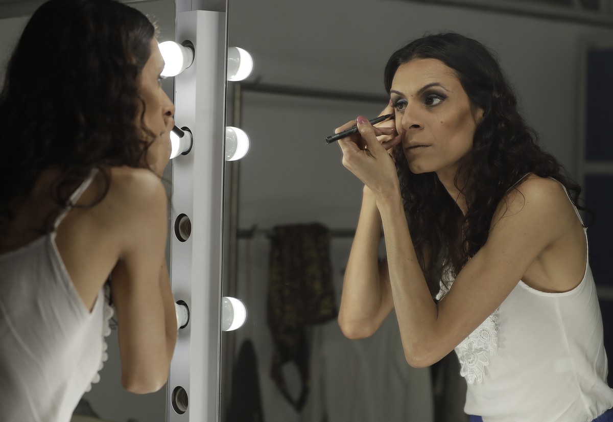 In this Sept. 27, 2017 photo, transgender actress Renata Carvalho prepares her makeup before playing the role of Jesus in the play "The Gospel According to Jesus, Queen of Heaven" in Sao Pau ...