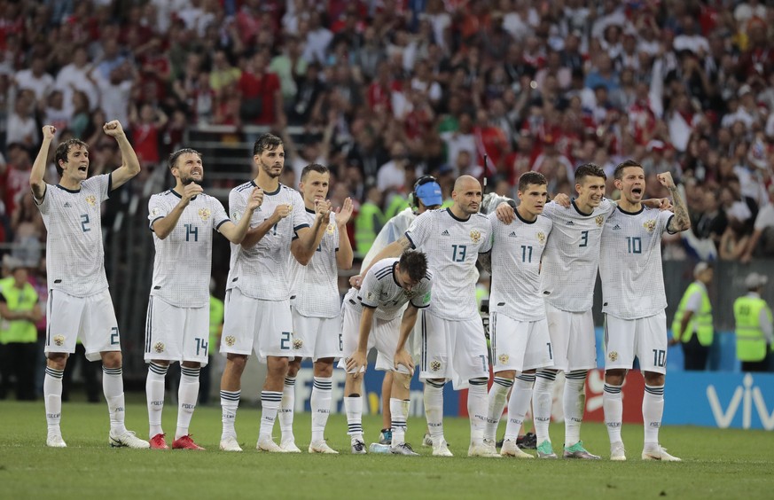 FILE - Players of Russia react during the penalty shootout of the round of 16 match between Spain and Russia at the 2018 soccer World Cup at the Luzhniki Stadium in Moscow, Russia, Monday, July 2, 201 ...