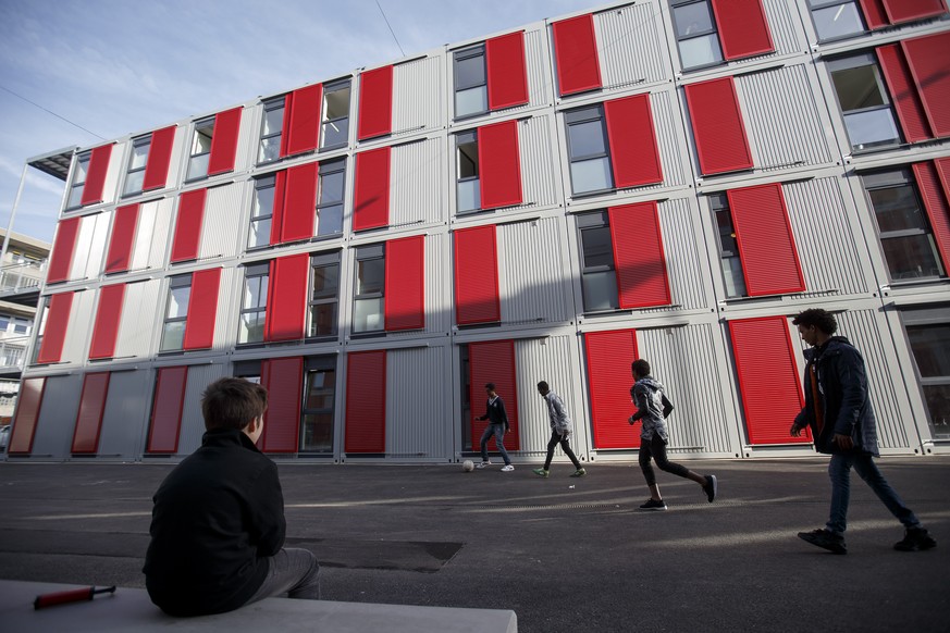 Young unaccompanied refugees play soccer at the new center for young migrants of the General Hospice, in Geneva, Switzerland, Friday, January 22, 2016. The canton of Geneva on Friday inaugurated a cen ...