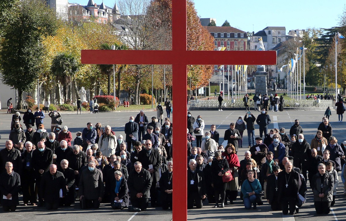 Bishops gesture on the forecourt of the Notre-Dame-du-Rosaire basilica in the sanctuary of Lourdes, southwestern France, Saturday, Nov. 6, 2021 during a ceremony, part of The Bishops' Conference, ...