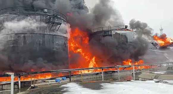 In this photo taken from video released by Governor of Bryansk Region Alexander Bogomaz telegram channel AV BogomaZ on Friday, Jan. 19, 2024, Oil reservoirs are seen in fire after the drone reached Kl ...