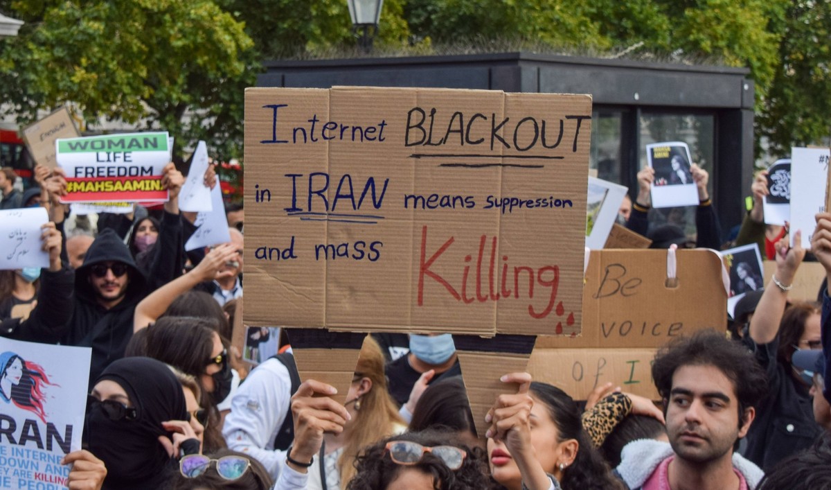 Mahsa Amini Death Protest At Trafalgar Square September 24, 2022, London, England, United Kingdom: A protester holds a sign which reads Internet blackout in Iran means supression and mass killing . Th ...