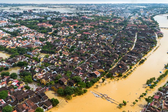 epa12494614 An aerial photo shows flood waters surrounding streets and houses after heavy rain in Hoi An, Vietnam, 31 October 2025. Floods triggered by record rainfall killed at least ten people and l ...