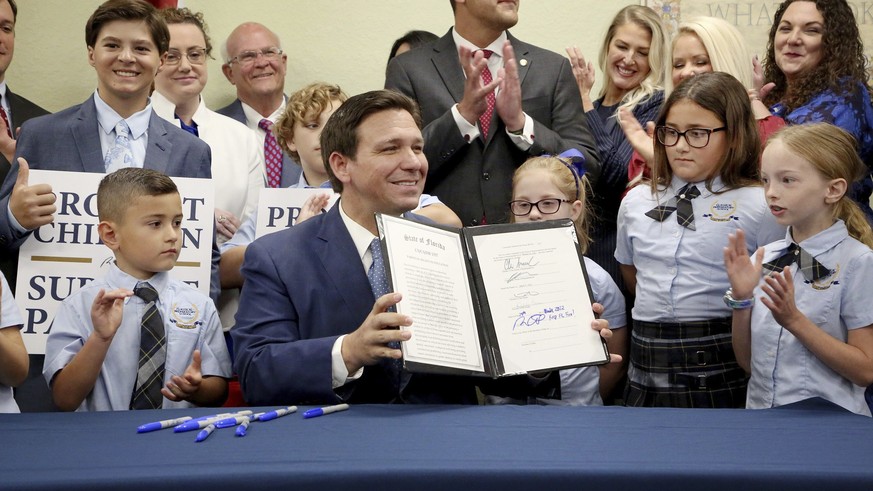Showing his toothpaste smile, Ron DeSantis signed the Parental Rights in Education Act, also known as the Don't Say Gay Act, on March 28, 2022.