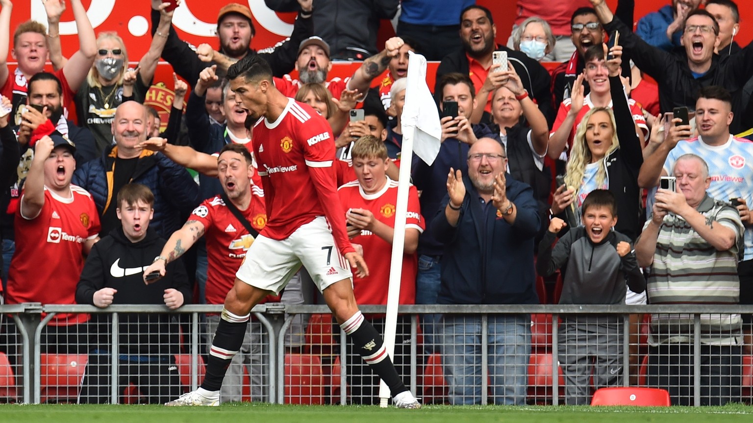 epa09461416 Cristiano Ronaldo of Manchester United celebrates scoring his team's opening goal during the English Premier League soccer match between Manchester United and Newcastle United in Mancheste ...