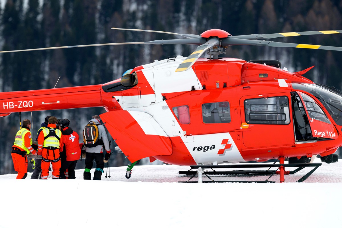 Michelle Gisin of Switzerland is being carried on a stretcher after a fall during an alpine ski, women's World Cup downhill training, in St. Moritz, Switzerland, Thursday, Dec. 11, 2025. (Keyston ...