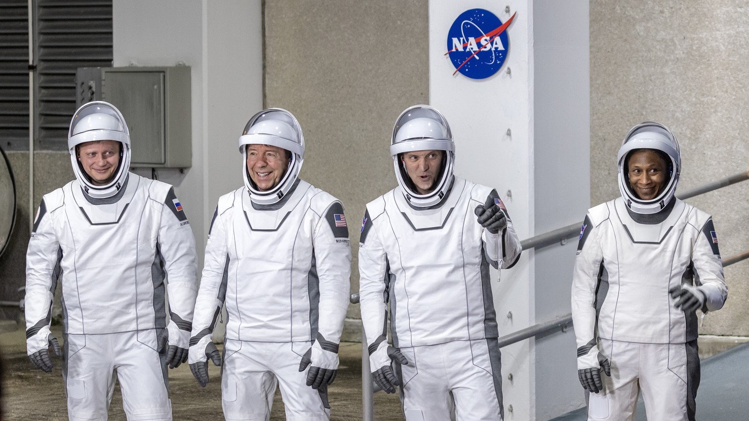 epaselect epa11197754 Members of the NASA SpaceX Crew-8 (L-R) Roscosmos cosmonaut mission specialist Alexander Grebenkin; NASA astronaut Michael Barratt, pilot; NASA astronaut Matthew Dominick, comman ...