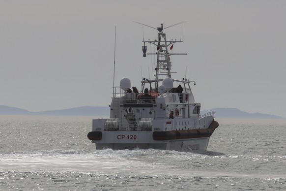 An Italian Coast Guard vessel carrying migrants from the asylum processing centers in Albania back to Italy, leaves the port of Shengjin, northwestern Albania, Saturday, Feb. 1, 2025. (AP Photo/Vlasov ...