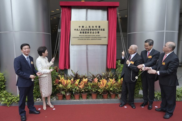 From left, Director of the Liaison Office and National Security Adviser to the Committee for Safeguarding National Security in Hong Kong Luo Huining, Hong Kong Chief Executive Carrie Lam, former Hong  ...