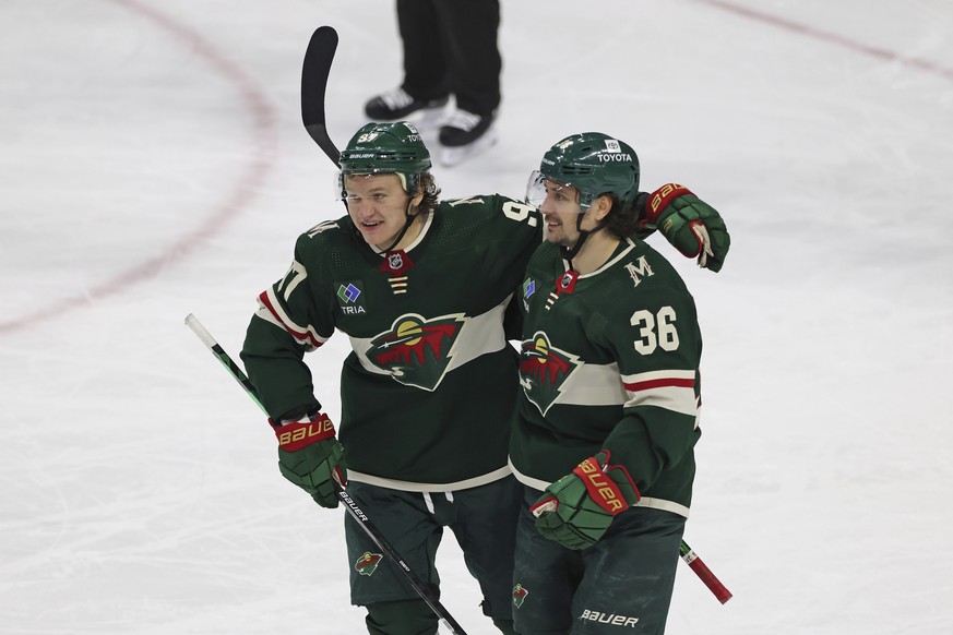 Minnesota Wild right wing Mats Zuccarello (36) celebrates with left wing Kirill Kaprizov (97) after scoring a goal against the Edmonton Oilers during the third period of an NHL hockey game Thursday, D ...