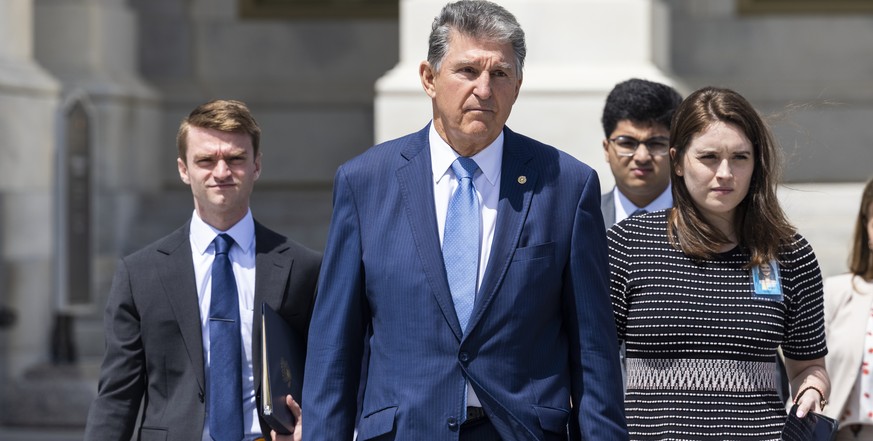 epa09299225 Democratic Senator from West Virginia Joe Manchin (C) joins other senators from the group of 10 to present their bipartisan transportation bill to US President Joe Biden outside the US Cap ...