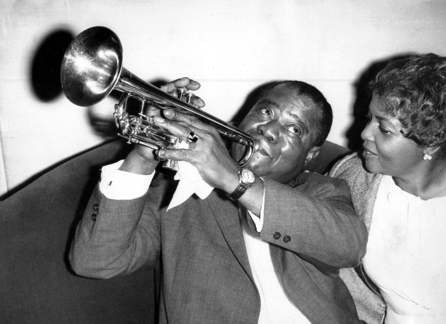 Dec. 10, 1960 - London, England, U.K. - One of the greatest jazz musicians of all time, LOUIS ARMSTRONG was responsible for innovations that filtered down through popular music to rock and roll. Armst ...