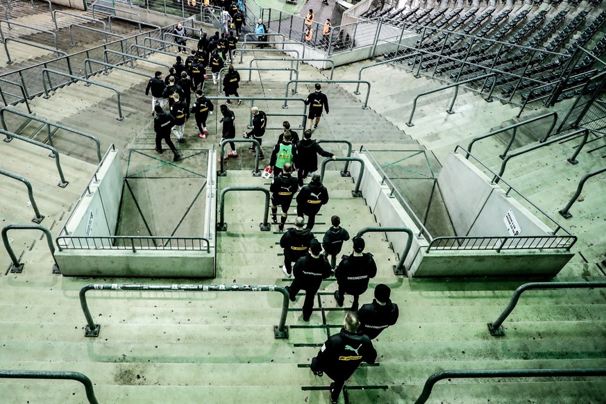 epa08287238 Players of Moenchengladbach walk on empty stands after they celebrated their victory with fans outside the closed gates after winning the German Bundesliga soccer match between Borussia Mo ...