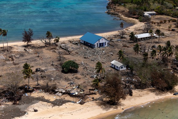 epa09732087 A handout photo made available by the Australian Government Department of Defence (DoD) shows damage at Atata Island, in Tonga, 28 January 2022 (issued 06 January 2022), following the erup ...
