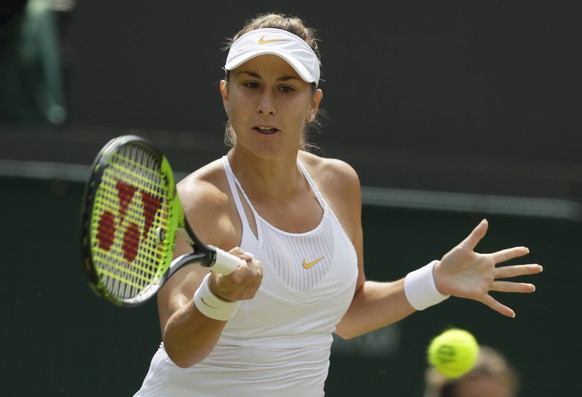 Belinda Bencic of Switzerland returns a ball to Angelique Kerber of Germany during their women&#039;s singles match on the seventh day at the Wimbledon Tennis Championships in London, Monday July 9, 2 ...