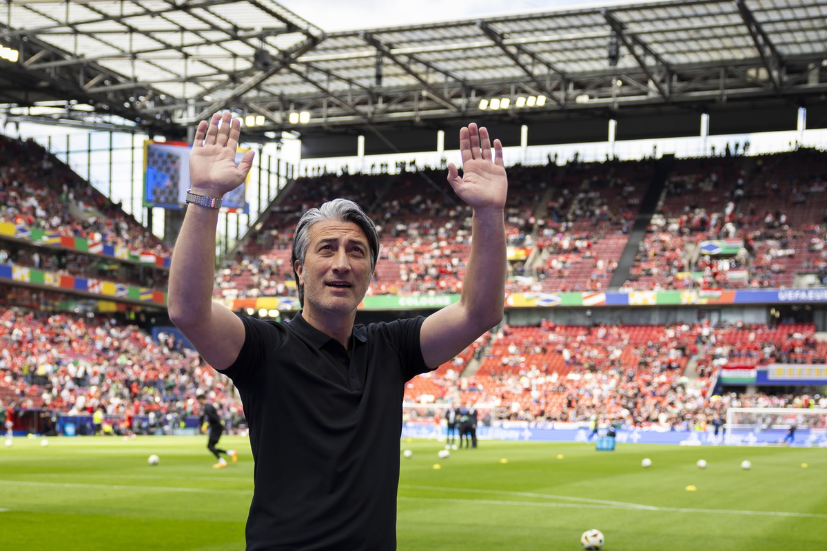 Switzerland's head coach Murat Yakin waves to the Swiss fans prior to a Group A match between Hungary and Switzerland at the Euro 2024 soccer tournament in Cologne, Germany, Saturday, June 15, 20 ...