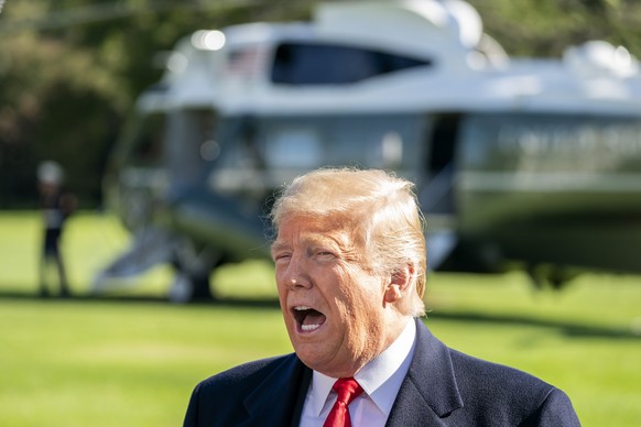 epa07112147 US President Donald J. Trump speaks to the media as he departs the White House for a Houston, Texas rally to support Senator Ted Cruz in Washington, DC, USA, 22 October 2018. Trump spoke a ...