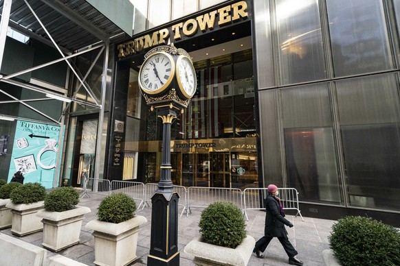 FILE ? A pedestrian passes security barricades in front of Trump Tower on Feb. 17, 2021, in New York. The stiffest penalty Donald Trump?s company could receive when it is sentenced Friday, Jan. 13, by ...