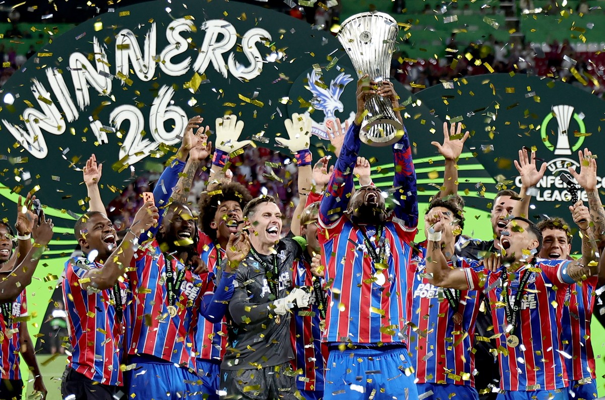 epaselect epa12998996 Crystal Palace player Jean-Philippe Mateta lifts the trophy as the team celebrate winning the UEFA Conference League final match Crystal Palace against Rayo Vallecano, in Leipzig ...