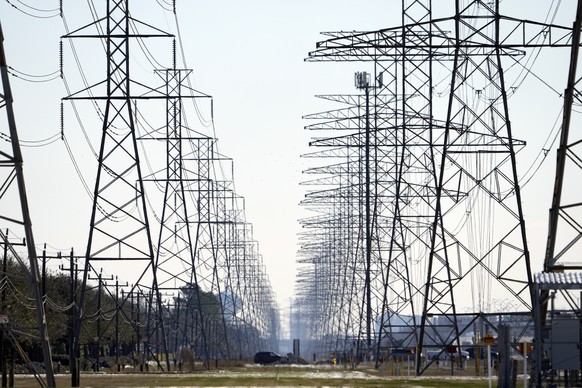 FILE - This Tuesday, Feb. 16, 2021 file photo shows power lines in Houston. The electric power grid manager for most of Texas has issued its first conservation alert of the summer, calling on users to ...