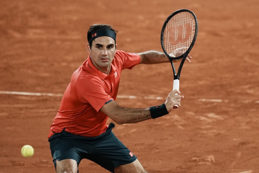 Switzerland&#039;s Roger Federer plays a return to Germany&#039;s Dominik Koepfer during their third round match on day 7, of the French Open tennis tournament at Roland Garros in Paris, France, Satur ...