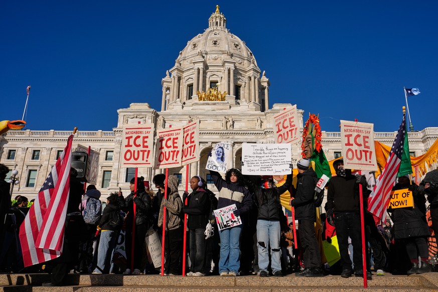 Hundreds of protesters gather in front of the Minnesota State Capitol in response to the death of Renee Good, who was fatally shot by an ICE officer last week, Wednesday, Jan. 14, 2026, in St. Paul, M ...