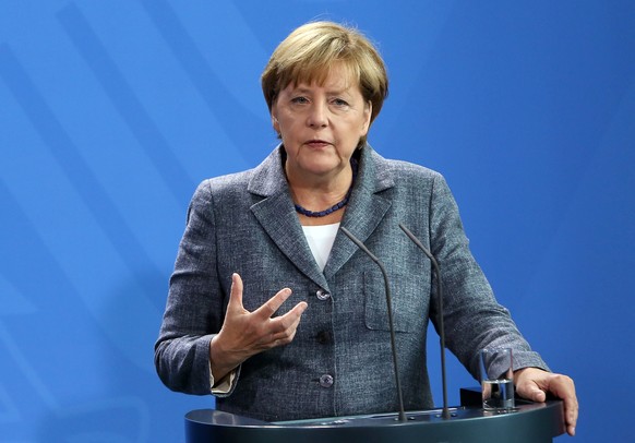 BERLIN, GERMANY - SEPTEMBER 15: German Chancellor Angela Merkel speaks to the media after talks on the ongoing refugee crisis, on September 15, 2015 in Berlin, Germany. After accepting record numbers  ...