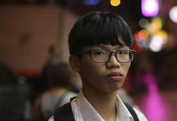 In this Nov.13, 2017 file photo, former Studentlocalism leader Tony Chung pose for a picture in Hong Kong. Three members of a former student group, include former Studentlocalism leader Tony Chung adv ...