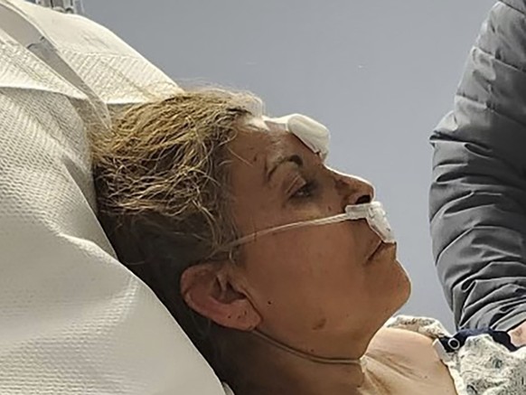 This photo provided by Aaron Paz shows Patricia Borges at Reading Hospital in West Reading, Pa., on March 25, 2023. Borges was pulled alive from the rubble of the R.M. Palmer Co. factory, a chocolate  ...