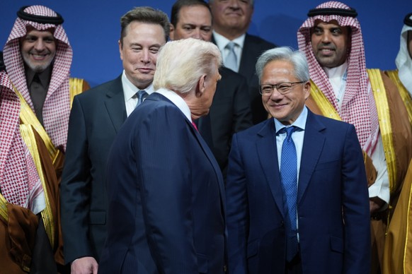 President Donald Trump speaks with Elon Musk and Nvidia CEO Jensen Huang, during the Saudi Investment Forum at the Kennedy Center, Wednesday, Nov. 19, 2025, in Washington. (AP Photo/Evan Vucci)
Donald ...