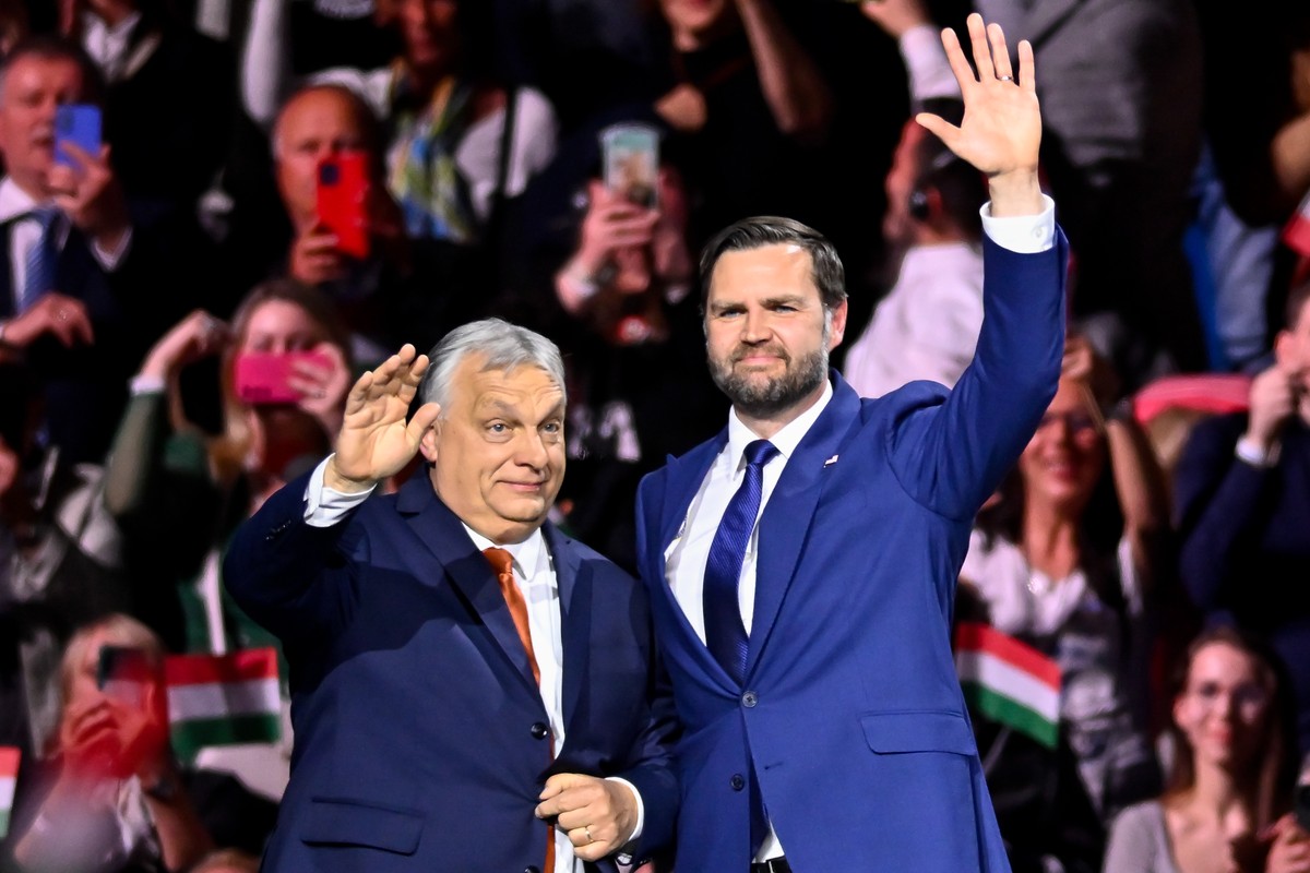 Hungary's Prime Minister Viktor Orban, left, and U.S. Vice President JD Vance wave to the audience at the end of a pre-election rally in Budapest, Hungary, Tuesday, April 7, 2026. (AP Photo/Denes ...
