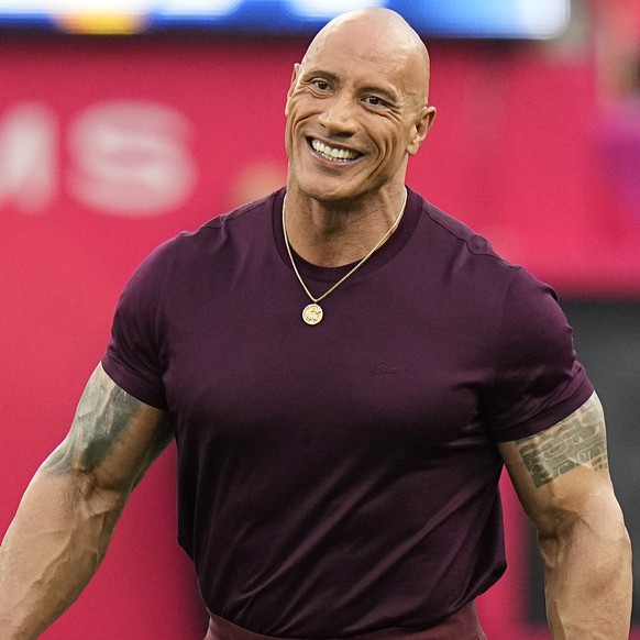Dwayne &quot;The Rock&quot; Johnson smiles before the NFL Super Bowl 56 football game between the Los Angeles Rams and the Cincinnati Bengals, Sunday, Feb. 13, 2022, in Inglewood, Calif. (AP Photo/Chr ...