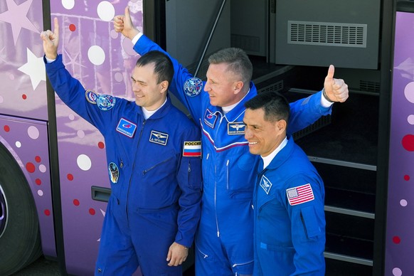 FILE - NASA astronaut Frank Rubio, right, Roscosmos cosmonauts Sergey Prokopyev, center, and Dmitri Petelin, members of the International Space Station (ISS) main crew, greet their relatives and…