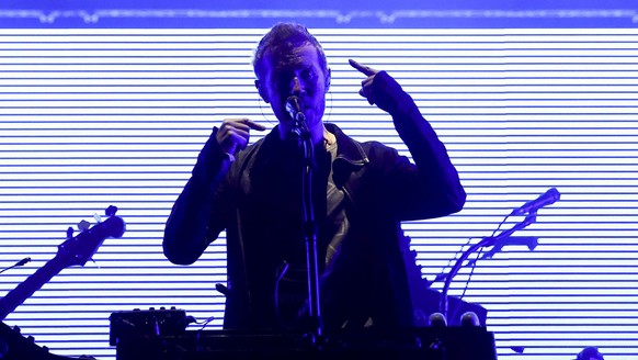 epa05427265 British musician Robert del Naja (R) of the British Trip Hop group 'Massive Attack' performs during a concert at the Super Bock Super Rock Festival in Lisbon, Portugal, 15 July 2 ...